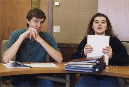 Aaron Romens and another student at a Senate meeting