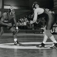 Two wrestlers face off at a start of a match