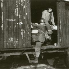 American soldiers traveling via box cars