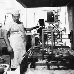 A cook at work, cafeteria kitchen