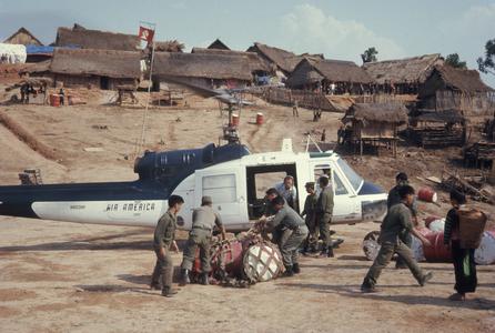 Soldiers loading helicopter