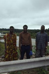 Three men in front of Ibadan Dam