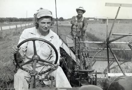 Woman driving tractor