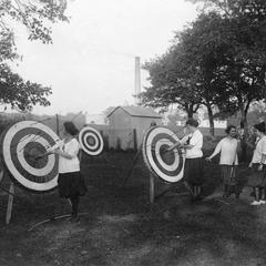 Women's archery group with targets