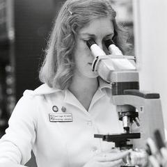 Carol Liegel at microscope