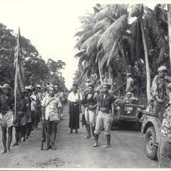 Guerrillas greet American troops, Jolo Island, 1945
