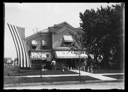 Home with flags, including a garrison flag