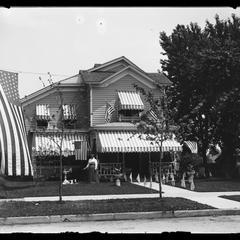 Home with flags, including a garrison flag