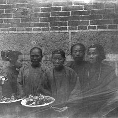 Doctor Taam Nai Won and family, with his bride on left.