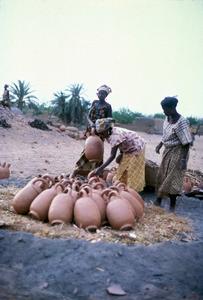 Women Preparing Water Pots for Firing
