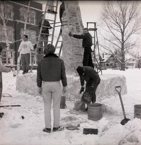 Students building snow sculpture