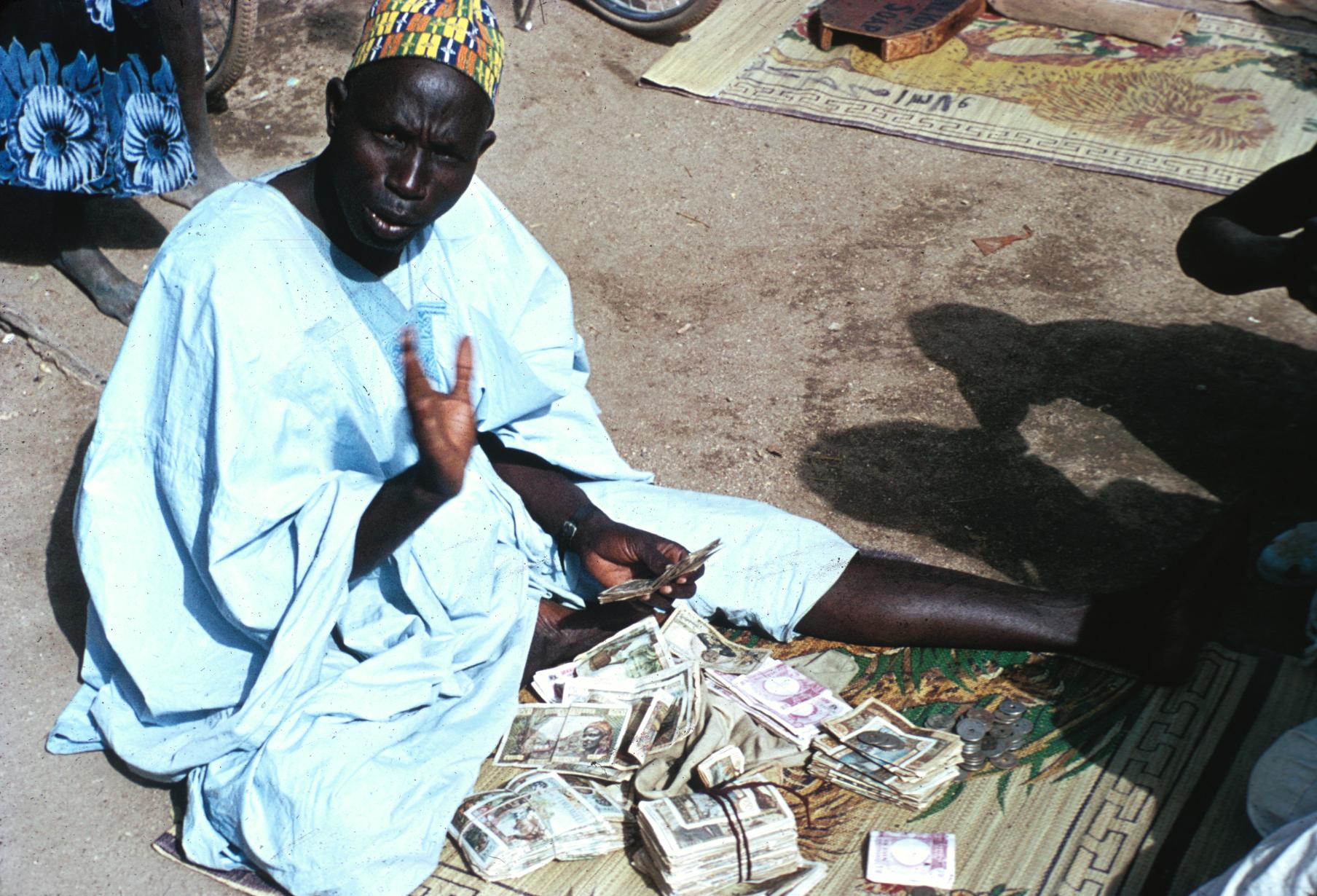 Hausa Banker and Money Changer in Maiduguri Market