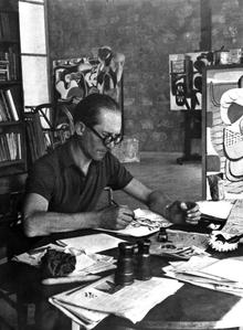 Le Corbusier at desk