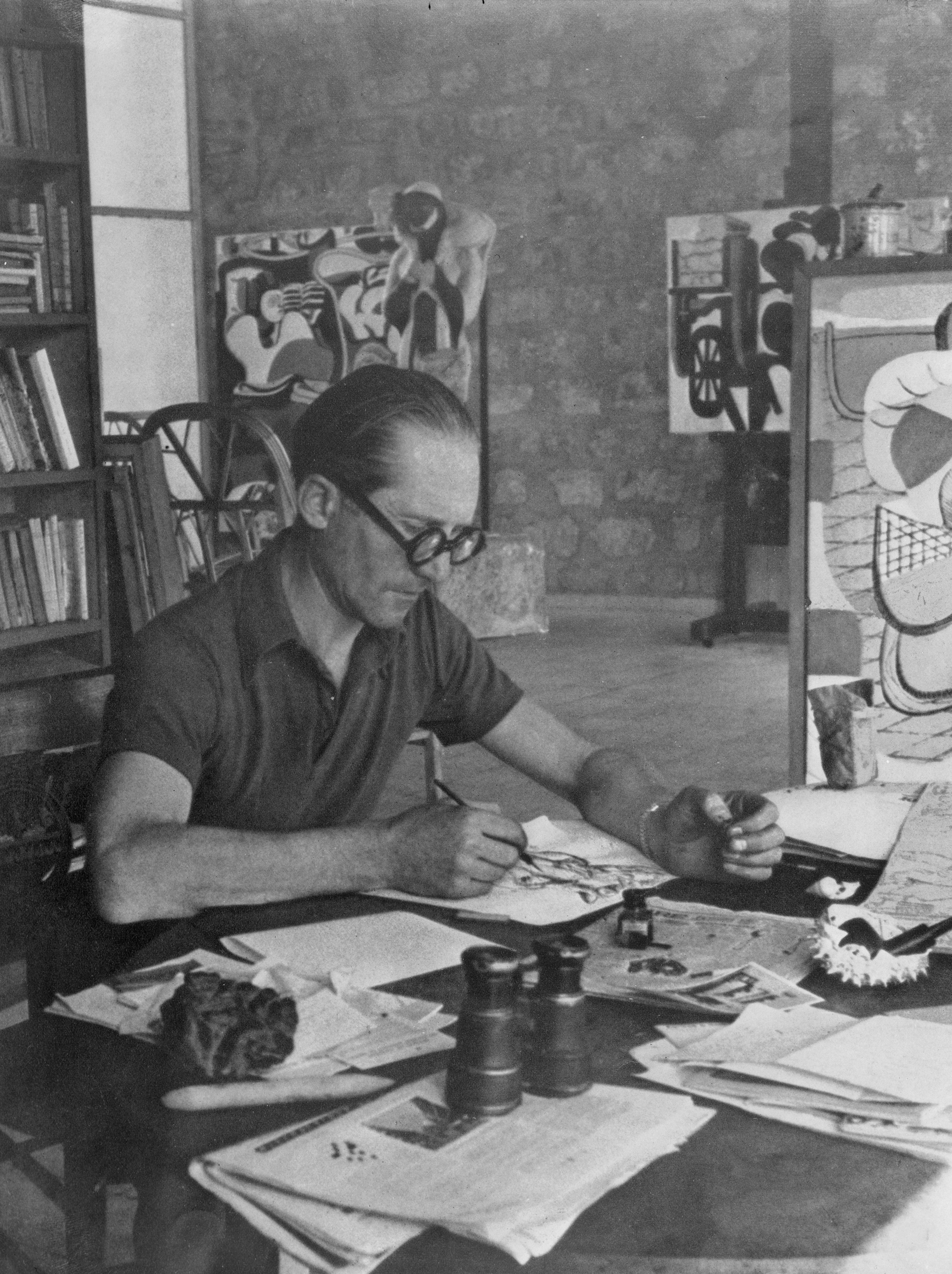 Le Corbusier at desk - UWDC - UW-Madison Libraries