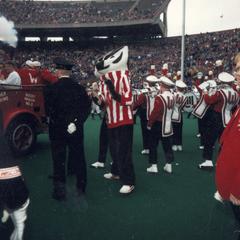 Bucky Badger with band at homecoming