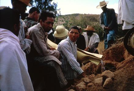 Placing Freshly-Wrapped Ancestors Back into Tombs During Exhumation Ceremony
