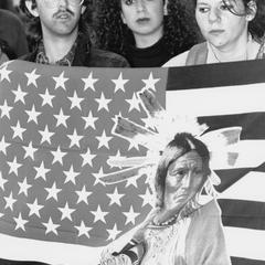 Students with Native American icon on flag