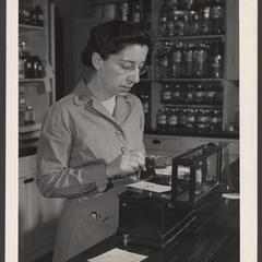 A woman works in a military pharmacy