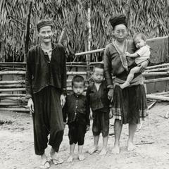 A Blue Hmong (Hmong Njua) family of 5 stands in a Hmong village in the vicinity of Muang Vang Vieng in Vientiane Province