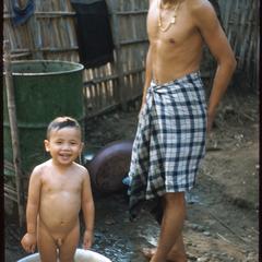 Father bathing son