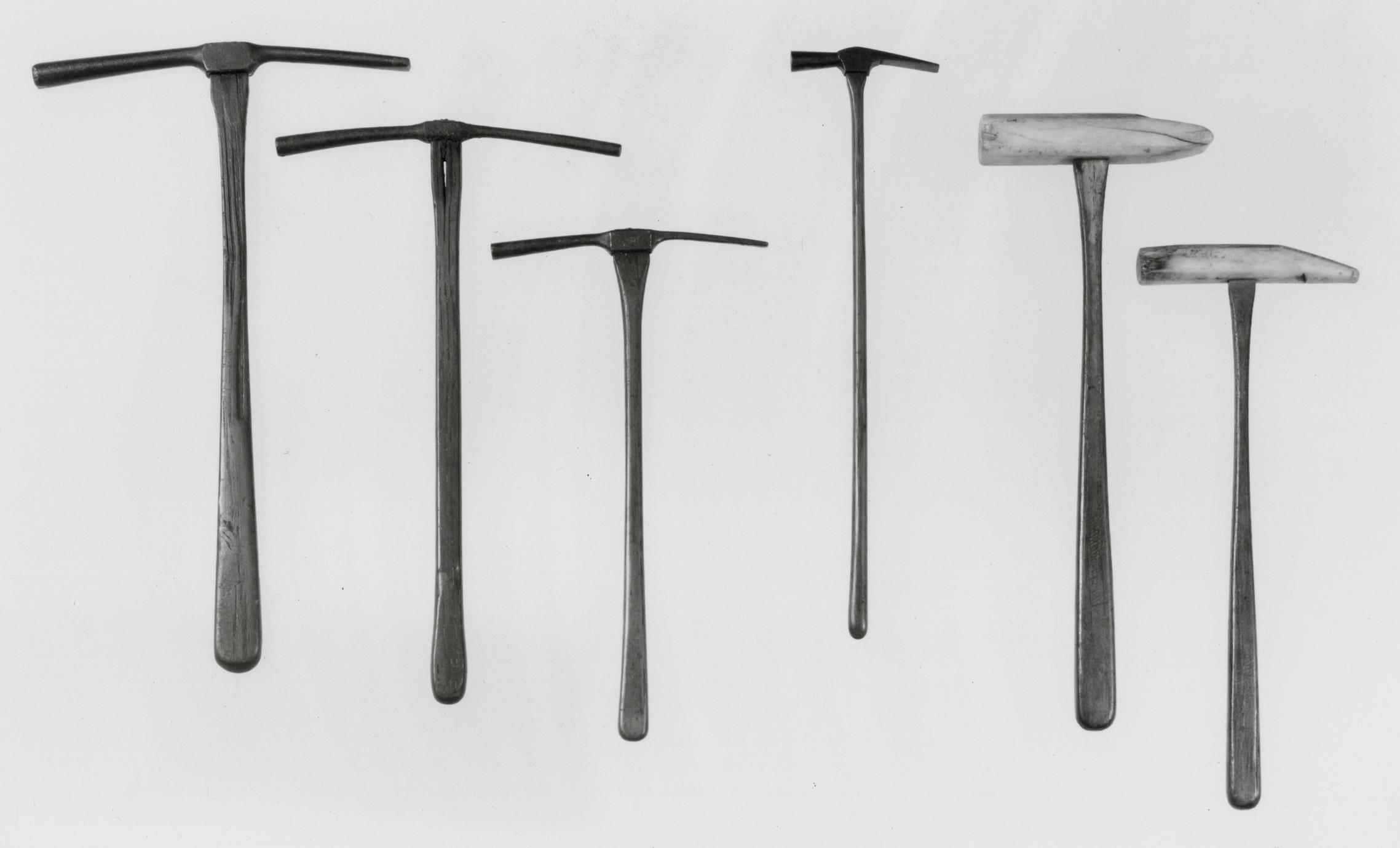 Black and white photograph of clock- and watchmaker's hammers.