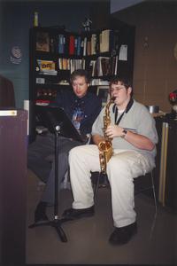 Music professor Dan Ackley with student