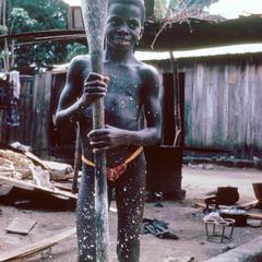 Ebrie Girl Preparing Cassava (Manioc)