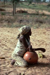 Hausa Woman Seated with Water Pot
