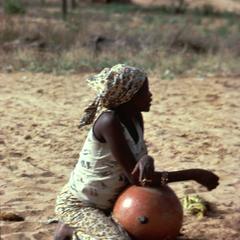Hausa Woman Seated with Water Pot