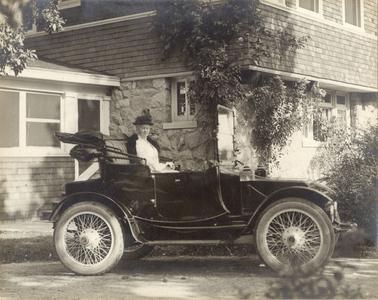 Delia Gallup and her electric car. Rochester, Wisconsin