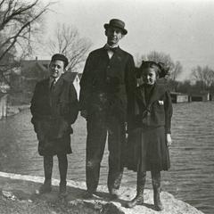 Clarence Loescher with two children