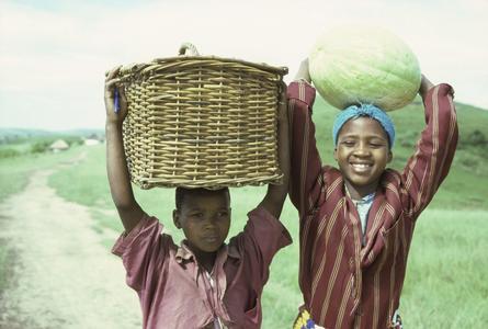 People of South Africa : boy with basket, girl with melon