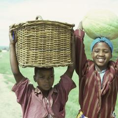 People of South Africa : boy with basket, girl with melon