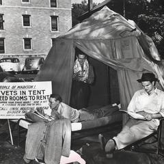 Vets read and shave in makeshift tent