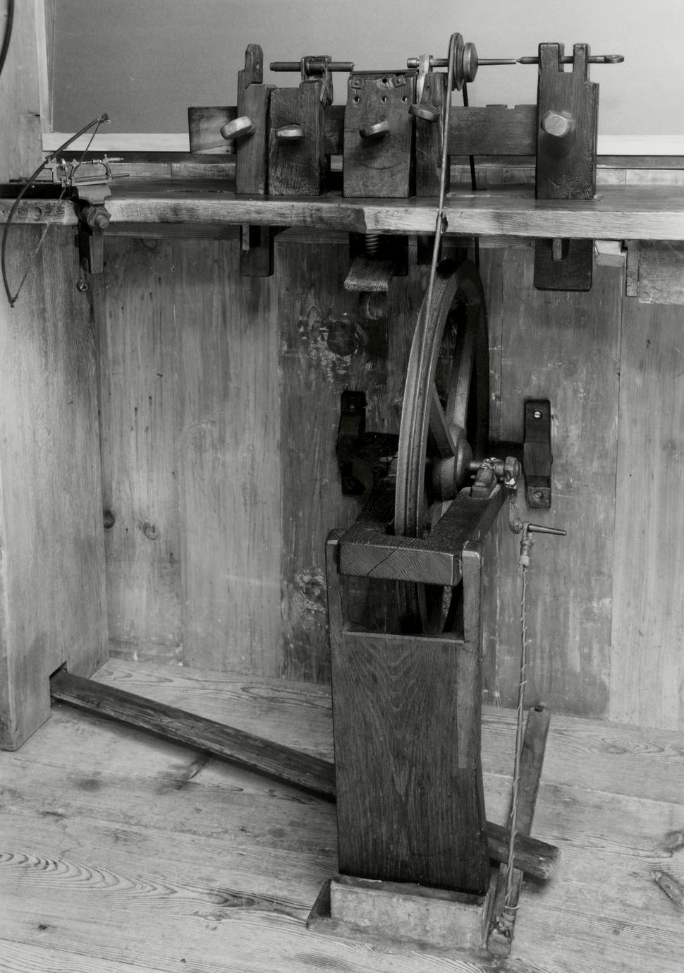 Black and white photograph of a hand lathe (turning bench).