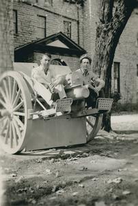 Students sitting on WWI canon on front lawn of Wisconsin Mining School