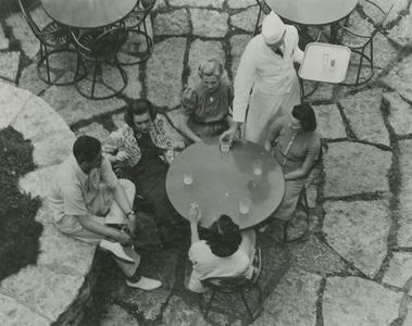 Waiter serving students on Terrace