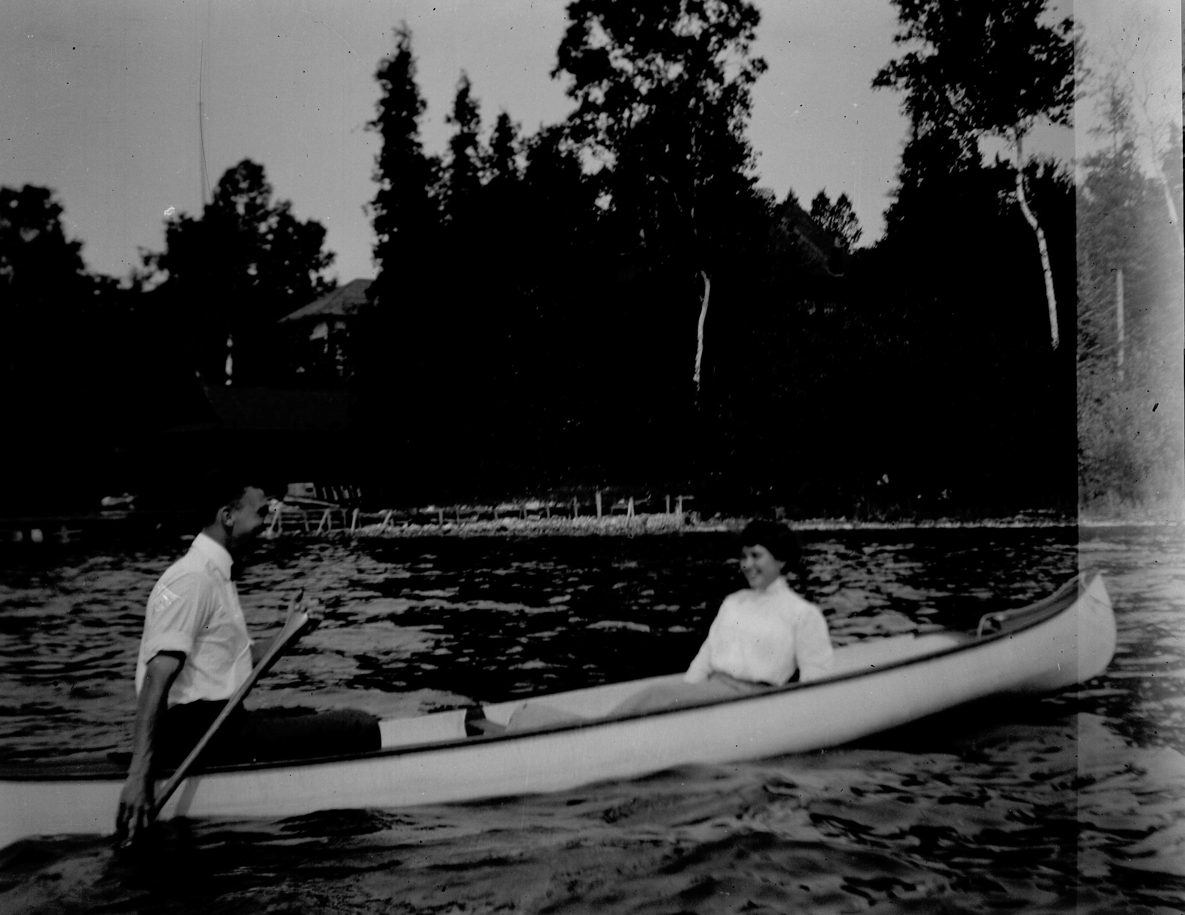‎Man and woman in canoe UWDC UWMadison Libraries