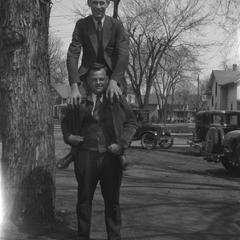 Student sitting on shoulders