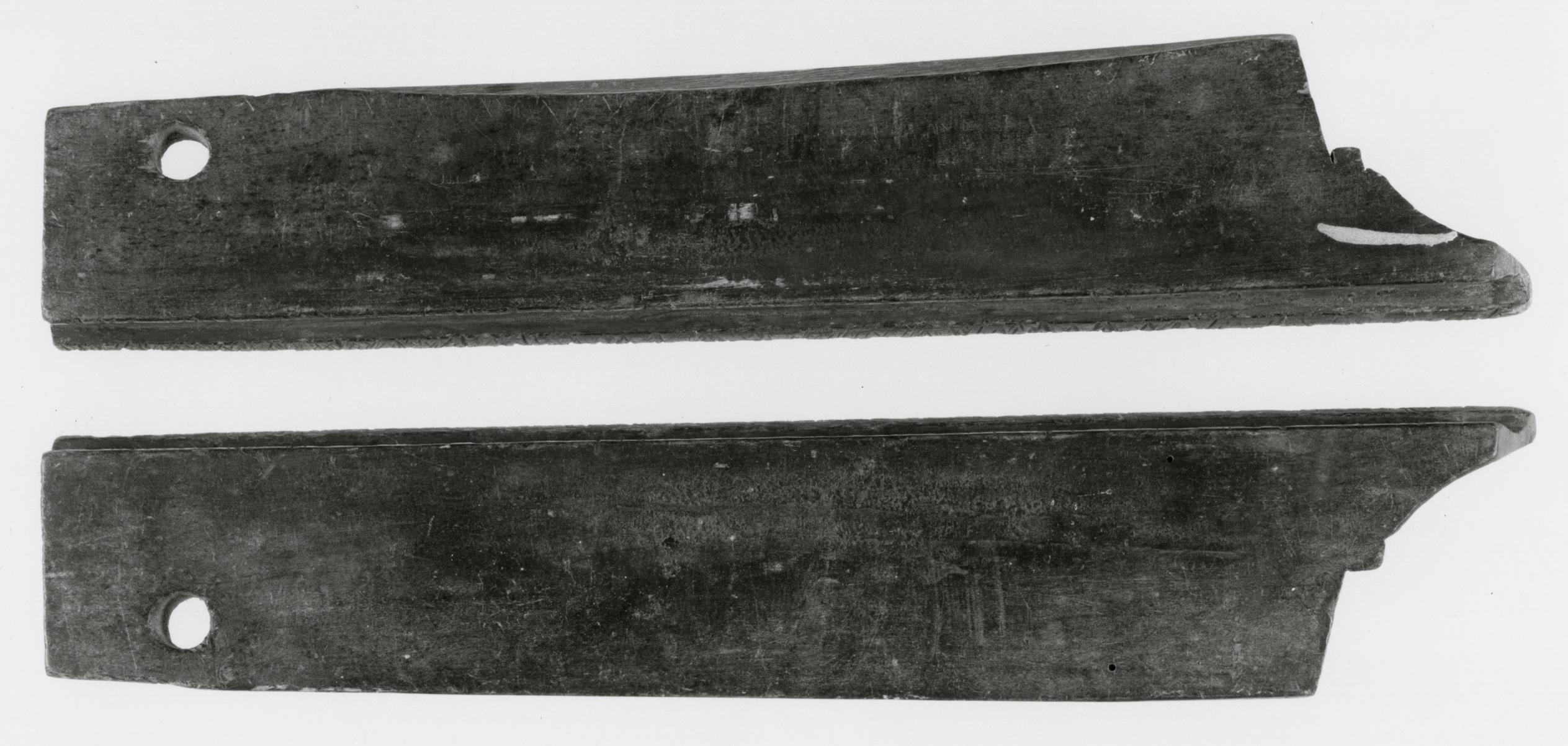 Black and white photograph of saw clamps or whetting blocks.