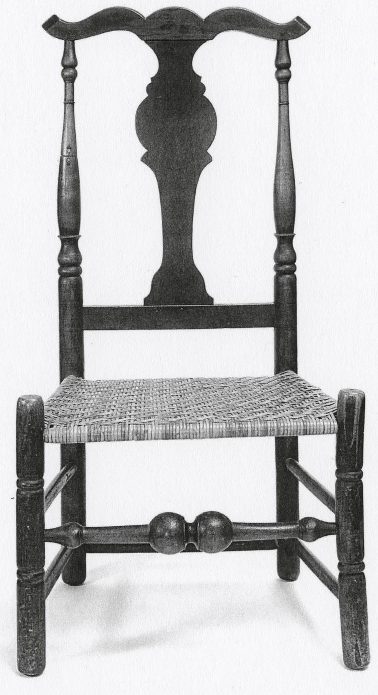 Black and white photograph of a fiddle-back side chair.