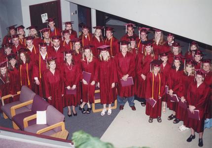 Students in regalia after graduation