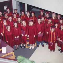 Students in regalia after graduation