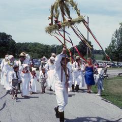 Pomeranian-American dancers with harvest pole