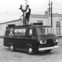 Student cameraman on top of UW-Green Bay Mobile Television Unit