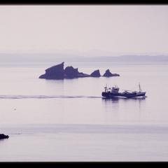 Fishing boat and skerries near the Summer Isles, the Highlands