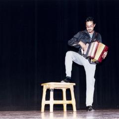 Nick Valdez plays accordion at 2000 MCOR