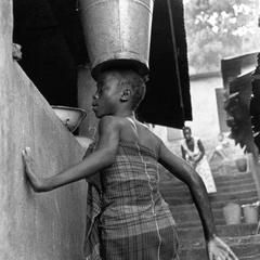Girl Bringing Water to Her House