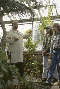 Rick Gitar lectures for students in greenhouse