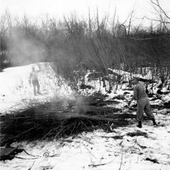 Aldo and another burning brush piles in winter